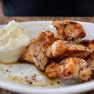 a plate of chicken and mashed potatoes