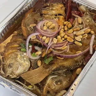 a tray of fish and vegetables