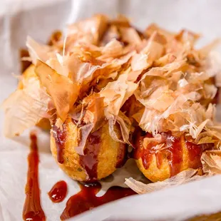 a hot dog with onions and ketchup