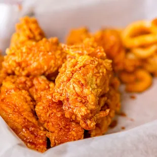 a basket of fried chicken and french fries