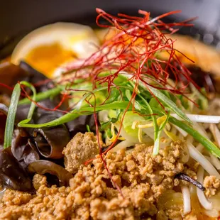 a bowl of noodles and meat