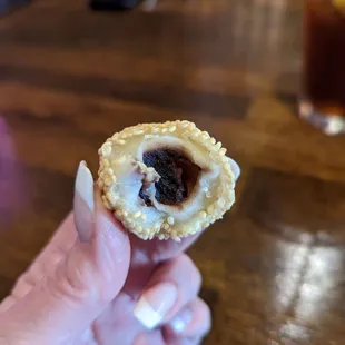 Sesame balls+inside is a red bean paste; sweet and tasty! And, I could eat 100!! Oink!