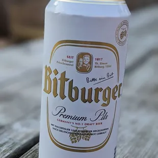 a can of beer on a wooden table