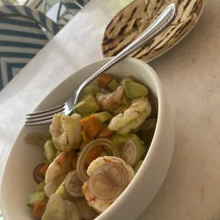 a bowl of food with a fork in it