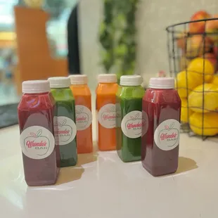 a variety of juices on a counter