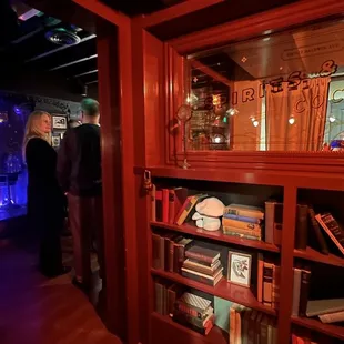 Secret book case opens up to the bar!