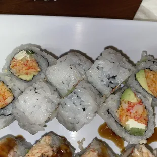 a plate of sushi rolls