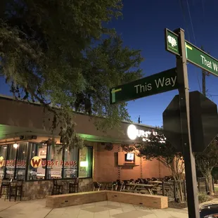 a restaurant and street sign