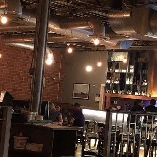 people sitting at tables in a restaurant