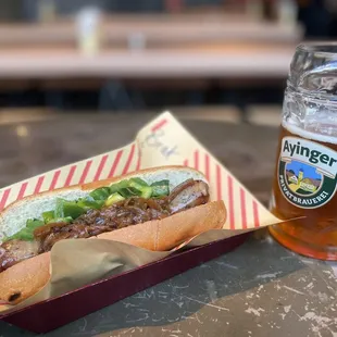 Brat with onions and hot peppers