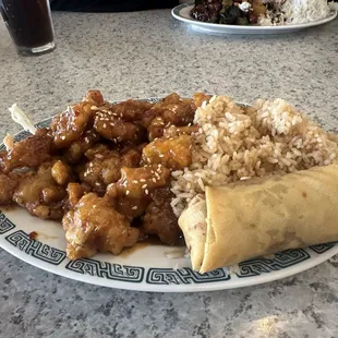 Lunch special Sesame Chicken with Friend rice and egg roll