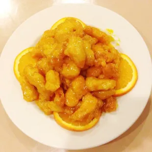 Orange Chicken : Handmade fired chicken, stirred fried. Homemade orange sauce.