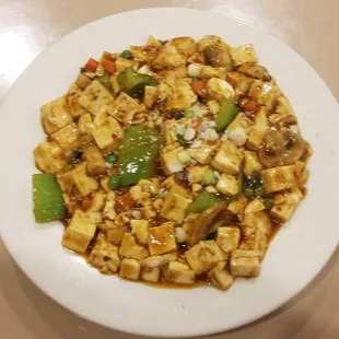a plate of tofu and vegetables