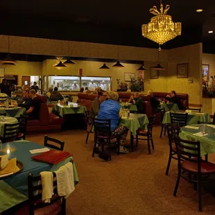 Showing the booth seating with a mirror wall behind them.