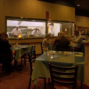 A view of their clean open kitchen area that is visible to their patrons.