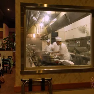 A closer view of their clean open kitchen area that is visible to their patrons.
