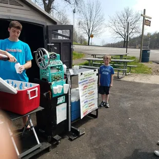 a man and a woman standing in front of a truck