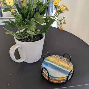 Flowers and coasters on a table