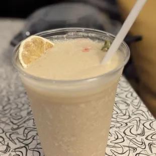 a smoothie in a plastic cup