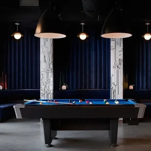 a pool table in the middle of a room