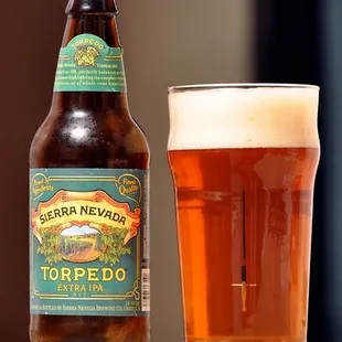 a bottle and a glass of beer