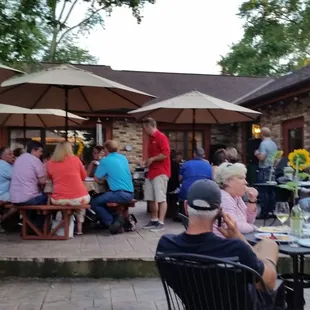 a large group of people sitting outside