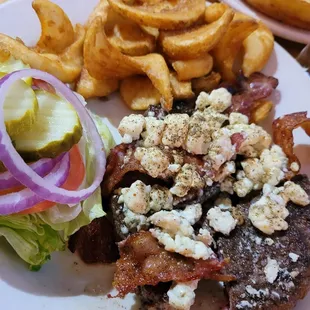 Blue cheese bacon burger with bun on the side, fun crescent fries