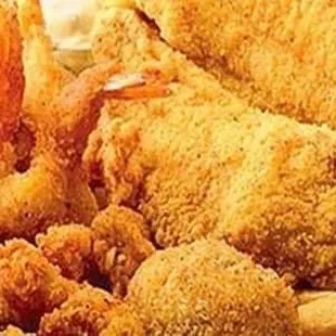 a plate of fried shrimp and fries