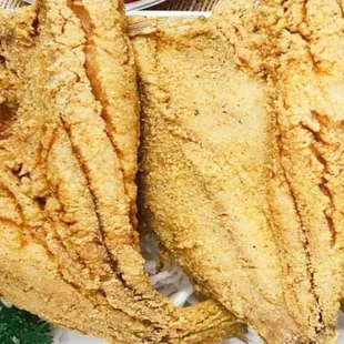 a plate of fried fish