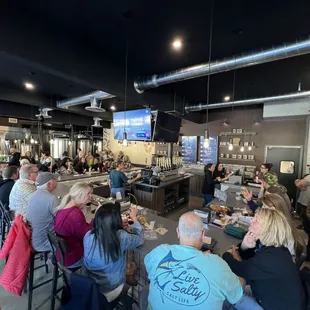 a large group of people at a bar