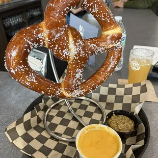 Soft pretzel with mustard and beer cheese