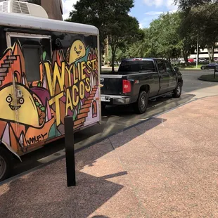 a taco truck parked on the side of the road
