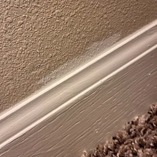 Paint on wall after painting baseboard