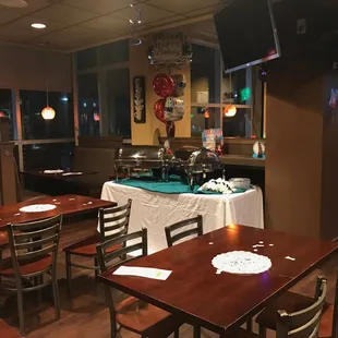 a restaurant with tables and chairs