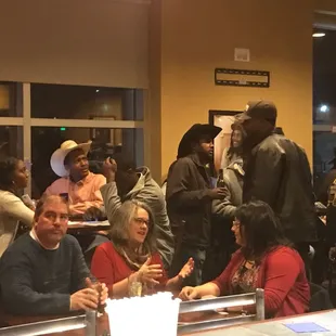 a group of people sitting at a table