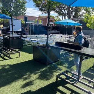 a woman standing under an umbrella