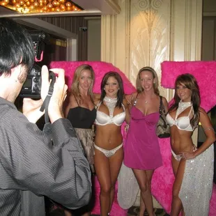 X girls posing with audience