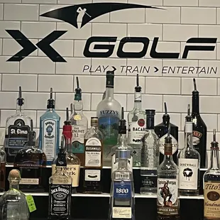 a variety of liquors on a bar