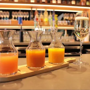 three glasses of orange juice