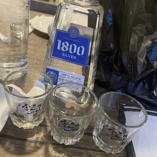 1800 tequila and 3 complimentary shot glasses