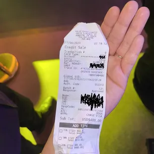 a person holding a receipt