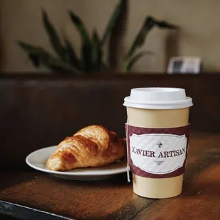 a plate of croissants and a cup of coffee