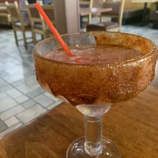 Pomegranate margarita with a Tajin and Chamoy rim. 11 out of 10 stars!