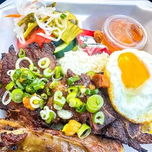 Cơm Tấm Đặc Biệt (Special, #1). Comes with pork chops, beef rib, shredded pork skins, fried egg, pickled veggie and fresh tomato/cucumber.