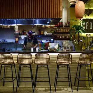 a bar with four stools