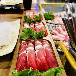 a table of raw meat