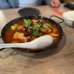 a bowl of soup and a bowl of rice
