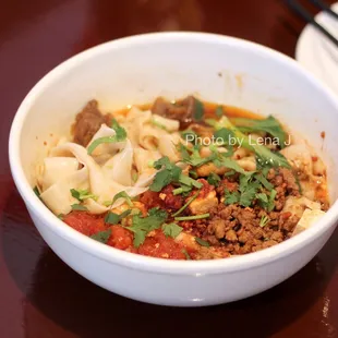 Biang Biang noodles with tomato, egg, black bean sauce with pork, braised beef and minced sauce 裤带面 ($13)