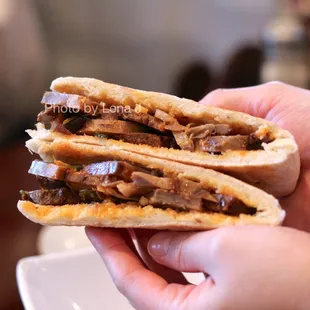 Inside of Marinated Pork Elbow Flat Bread 蹄膀夹馍 ($6) - better than the cumin lamb burger