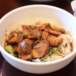 Hand-stretched noodles in hot &amp; sour sauce +pork elbow 油波面加蹄膀 ($12) - not very spicy. Noticeable vinegar flavor.